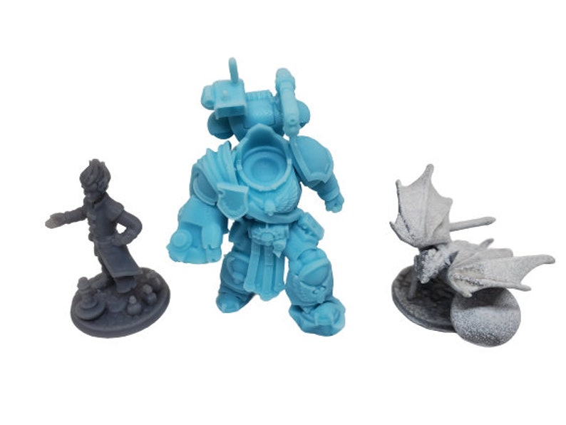 Three custom resin-printed tabletop miniatures